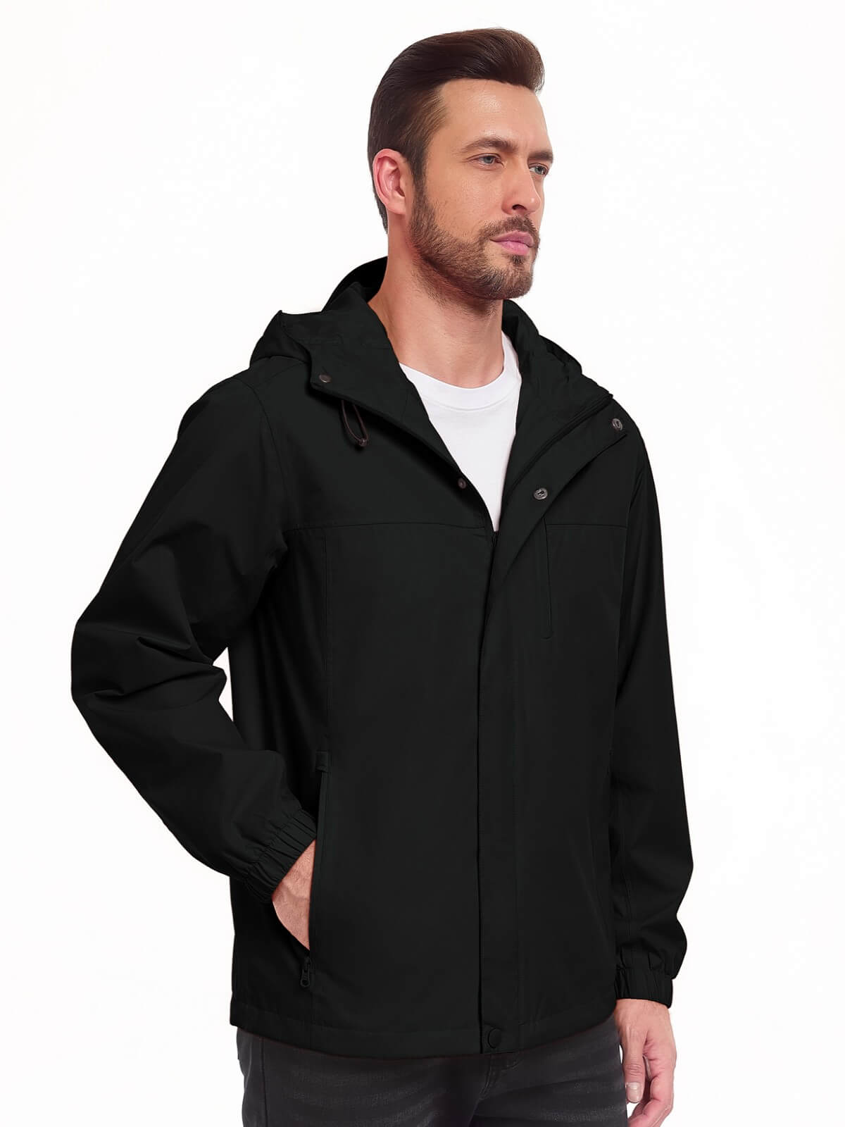 A man wearing a black hooded jacket over a white t-shirt, shown from the waist up against a plain white background.
