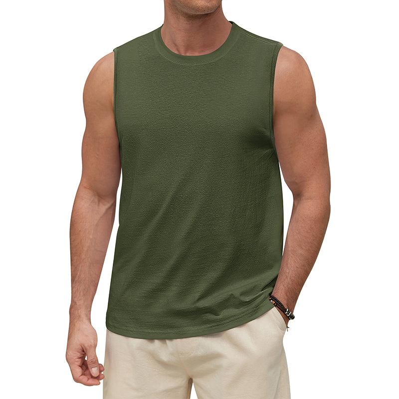 Man wearing a green sleeveless shirt and beige pants